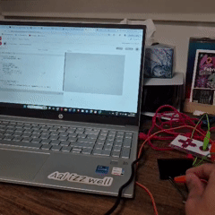 Tapping the binder clip connected to the SPACEBAR on the Makey Makey spawns pink circles that grow and gradually fill the entire screen.