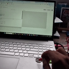 Tapping the coin connected to the SPACEBAR on the Makey Makey triggers a yellow particle explosion that spreads into small pieces.