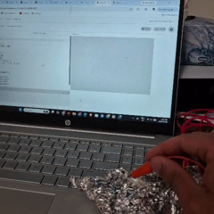 Tapping the tin foil connected to the RIGHT - on the Makey Makey generates random lines that appear independently across the canvas.
