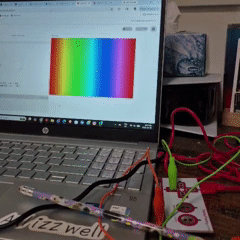 Tapping the pencil connected to the BOTTOM - on the Makey Makey increases the brightness of the rainbow background, making the colors lighter.