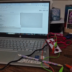 Tapping the pencil connected to the SPACEBAR on the Makey Makey spawns random emojis that fall from the top of the screen.